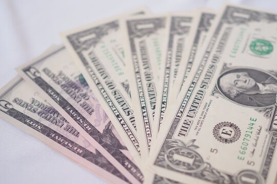 USD currency , Many dollar bank notes Placed on the table.The  Dollar is the currency of USA that is used to change, buy, sell, accumulate, and invest in united kingdom's state people.
