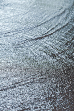 flooded street with streams of rain water. rainy day in the city.