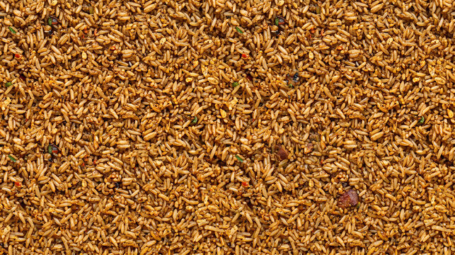 Golden brown cereal grains scattered uniformly creating a textured background