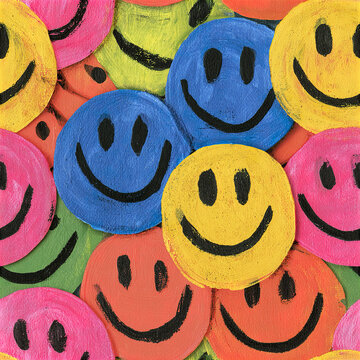 Colorful smiley face pattern with overlapping happy expressions painted on textured surface, creating joyful and vibrant mood