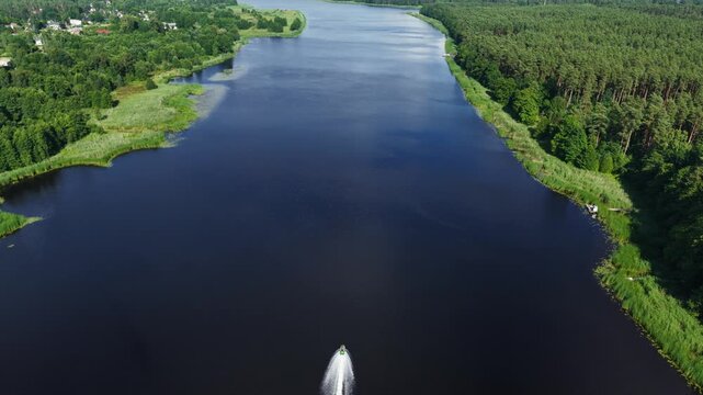 Aerial view of boat wake on Lielupe River between Sloka and Valteri, Latvia area