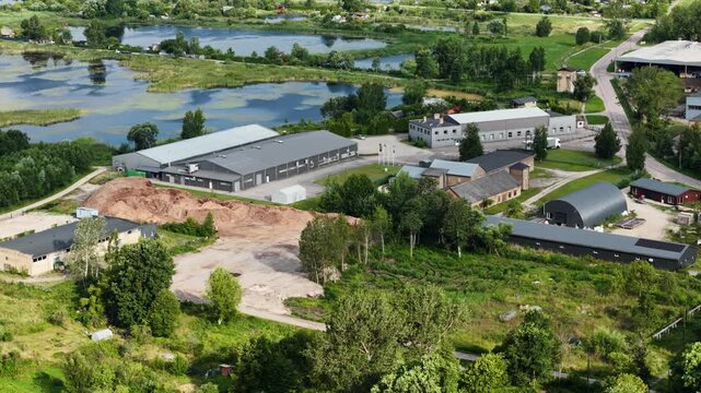 Drone slides right above manufacturing complex beside Lielupe, Kalnciems, Latvia