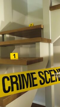 Domestic crime scene investigation with yellow tape across a modern wooden staircase, where numbered evidence markers are placed on the steps, indicating a forensic examination in progress