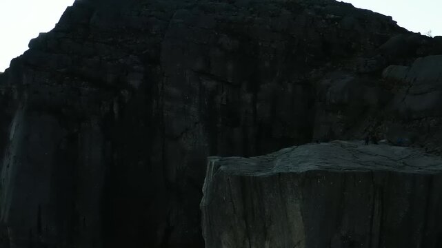 Dark columnar basalt rock formations in quarry landscape