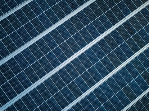 Aerial view of solar panels arranged in neat rows, showcasing clean energy technology and modern infrastructure in Salatiga, Central Java, Indonesia.