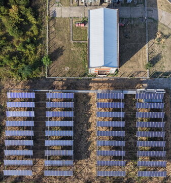 Aerial view of a solar panel array installed in the South Industrial Zone, featuring rows of photovoltaic panels next to an industrial building in Pancevo, Serbia.