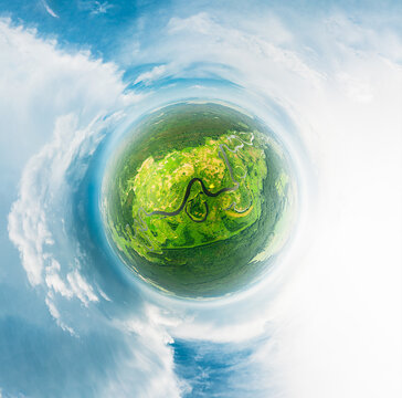 Aerial View Green Forest Woods And River Landscape In Sunny Summer Day. Top View Of Beautiful European Nature From High Attitude. Drone View. Bird's Eye View. Little Small Planet Concept