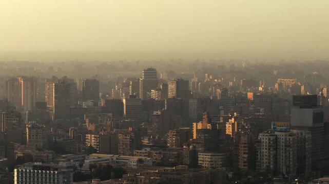 Aerial View of Cairo Dense buildings and Giza Cityscape at Golden Sunset