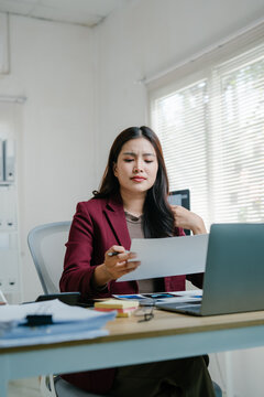 Businesswoman experiencing stress and burnout while working in office
