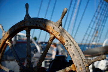 Traditional wooden ship steering wheel on sailing vessel deck, Gdynia port, Pomeranian Voivodeship, Poland, Europe © sebastiangora