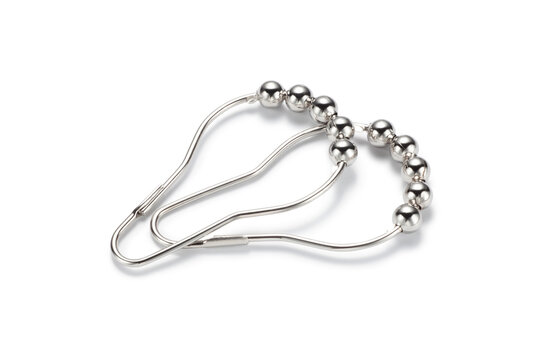Metal curtain rings with rolling balls on white background, Used to secure curtains to the curtain rod