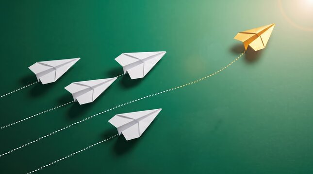 Paper airplanes flying upward with one golden plane leading the way symbolizing success and teamwork