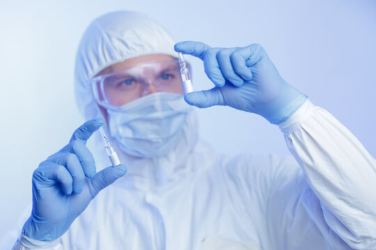 Development and invention of vaccine medicine. Scientist making quality control of glass slide ampoule in pharmaceutical laboratory.