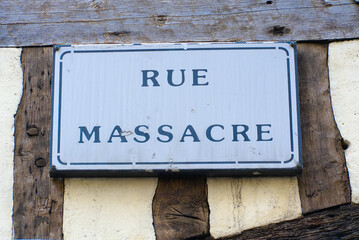 Naklejka premium Cityscape with Rue Massacre street name sign at the old town of French city of Rouen on a summer day. Photo taken July 13th, 2026, Rouen, Normandie, France.