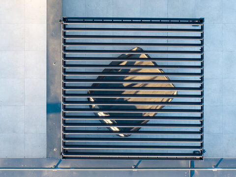 Aerial view of a modern louvered pergola structure on a tiled rooftop in Belgrade, Serbia.