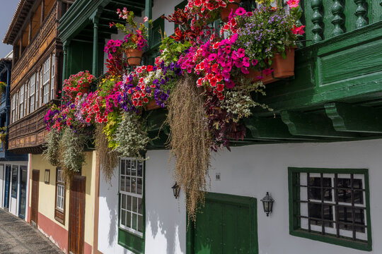 The Balcones de la Avenida Maritima, town houses with wooden balconies decorated with colourful flowers in Santa Cruz de La Palma, the capital of La Palma, Canary Islands, Spain.