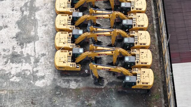 Excavator sales or rental places, many excavators are parked in a row to be shown off