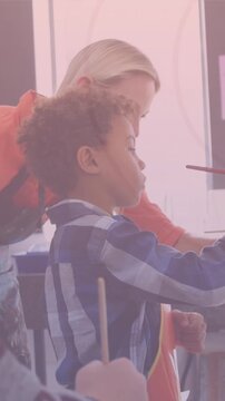 Animation of shapes over diverse schoolchildren painting