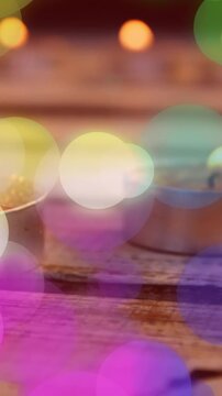 Animation of spots of light over christmas tea lights