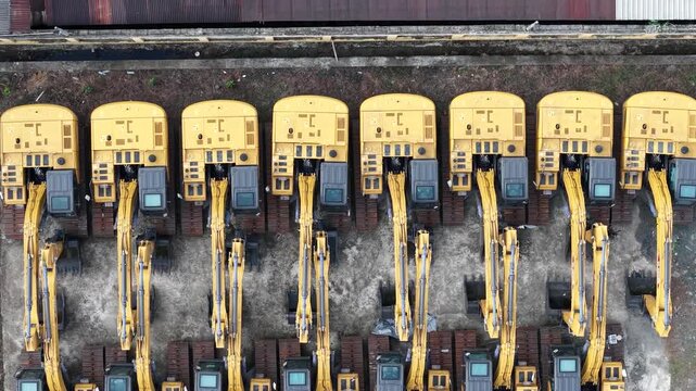 Excavator sales or rental places, many excavators are parked in a row to be shown off