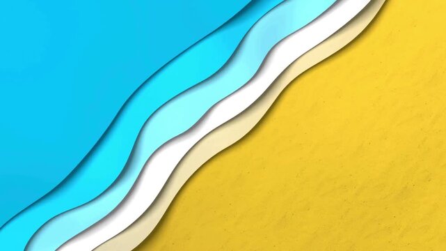 Abstract overhead shot of ocean waves rolling onto sandy beach with blue and aqua water and white foam motion.