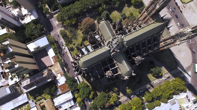4K drone aerial view of La Plata Cathedral in Buenos Aires, Argentina. One of the largest Gothic revival churches in the world, featuring impressive architecture in the heart of the city.