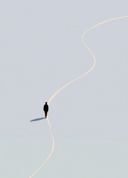 Person walking on a long, straight line that stretches across a light blue sky. the person is wearing a black suit and is walking towards the right side of the image.