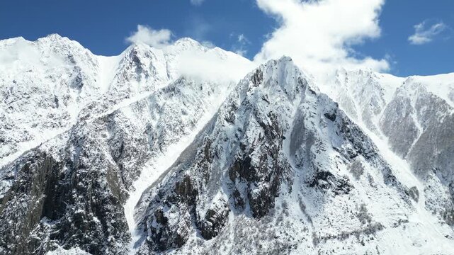 Aerial Close Up of Rakaposhi Mountain and Glacier in Hunza Valley Pakistan with Snow Covered Peaks and Dramatic Karakoram Alpine Landscape