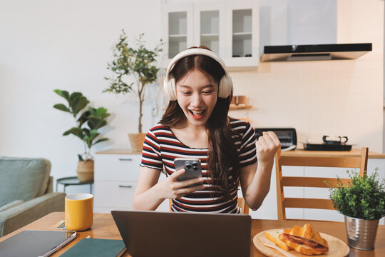 Asian woman using computer remote for business studying, watching online virtual webinar training meeting, video call. asian business woman talking on laptop in home office. Banner, copy space