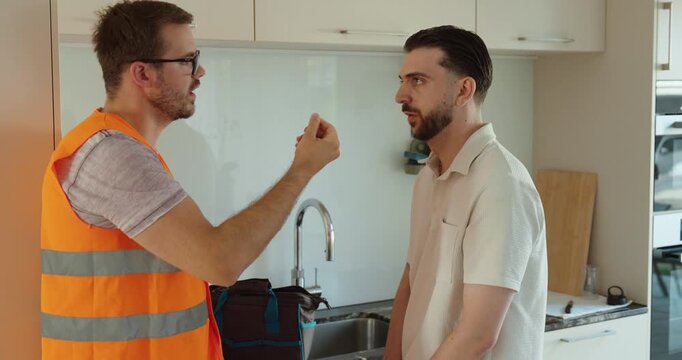 Close-up of a customer paying a service technician in cash after a completed home repair. Concept of professional service, maintenance, and payment.