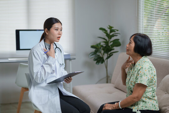 Doctor discussing sore throat with senior patient