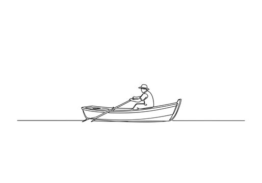 Fisherman rowing small boat across calm water for fishing