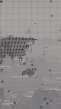 Animation of world map and spinning globe against aerial view of cityscape