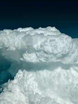 Super active storm CB cell in dramatic dark blue picture taken from the cockpit