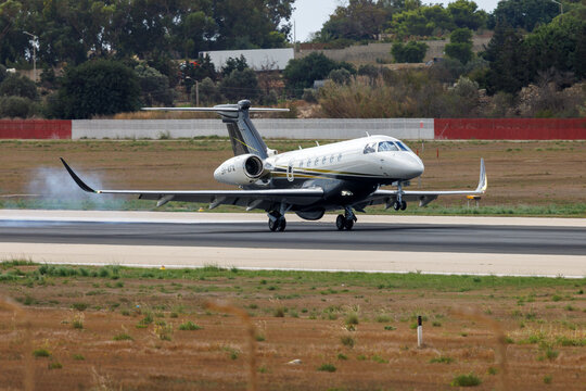 Luqa, Malta - September 25, 2023: Flexjet Embraer EMB-550 Praetor 600 (REG: 9H-KFX) landing runway 31.
