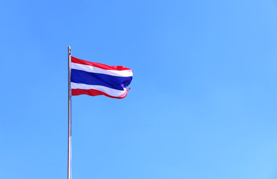 Flag of Thailand on clear sky background. Thailand Flag Waving in Wind on Flagpole. Copy space for text