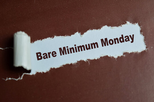 Bare minimum Monday text written in torn paper.