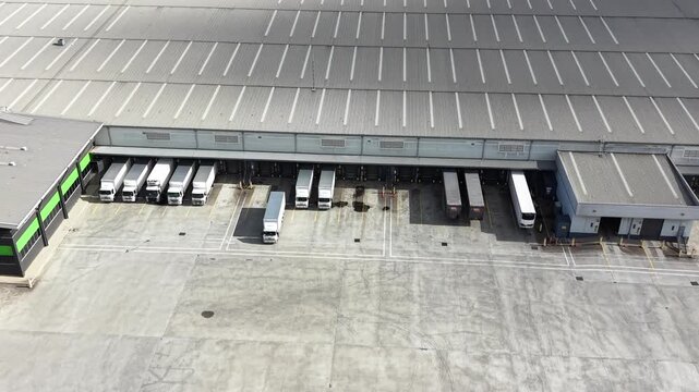 Aerial view of a truck leaving loading docks at a warehouse