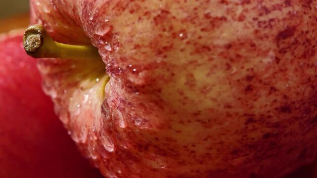 Close-Up of Red Apple Covered with Water Droplets