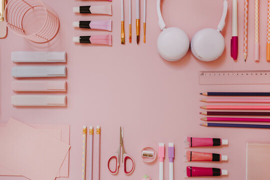 Symmetrical Flat Lay Frame Of Pastel Pink School Supplies And Art Accessories With Blank Central Copy Space