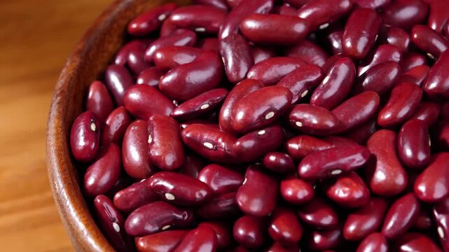 Dried red beans in a wooden bowl