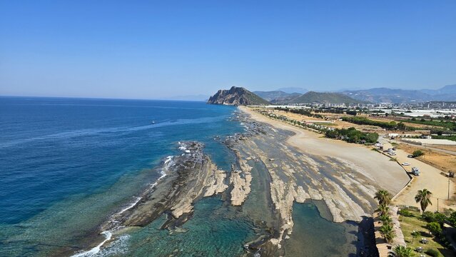 Stunning wide angle landscape of Koru Beach coast featuring ancient geological tide pools