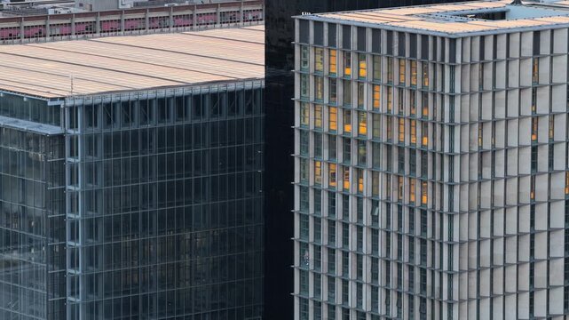 Aerial view of modern office buildings with glass facades and geometric grid patterns in the EUR district in Rome, Lazio, Italy.