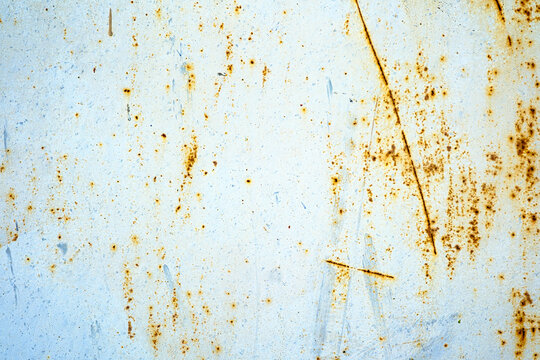Weathered metal texture with rust spots and scratches
