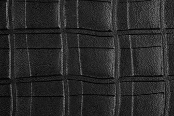Fototapeta premium Macro shot of black leather texture with quilted pattern