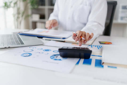 Business doing finances and calculating financial report with business graph growth chart, finance and investment Business Financing Accounting Banking Concept.