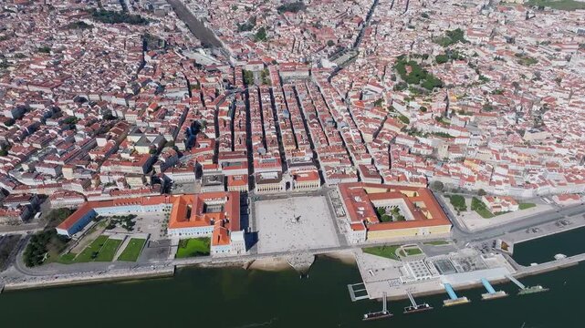 High angle drone view of Lisbon metropolitan area, Commerce Square and Rua Augusta Arch on Tagus River, Lisbon geography