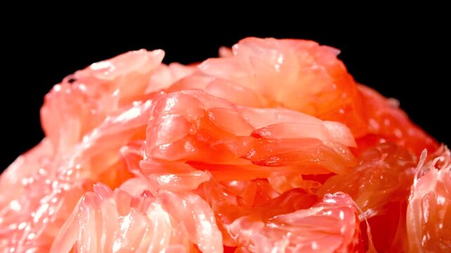 Macro Shot of Fresh Red Pomelo Pulp on Dark Background