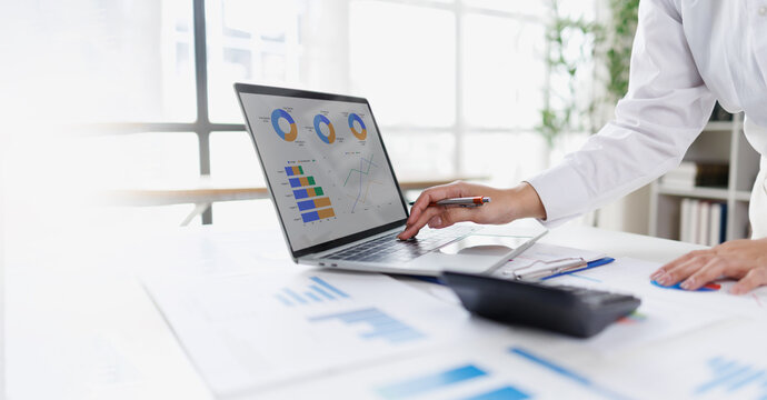 Business professional investor working new start up project. tablet laptop computer with digital marketing media in virtual icon design Finance managers meeting.
