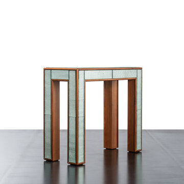 elegant designer console table with wooden structure and cut crystal covering